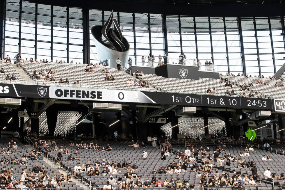 Raider fans take in the action during a special training camp practice for season ticket holder ...