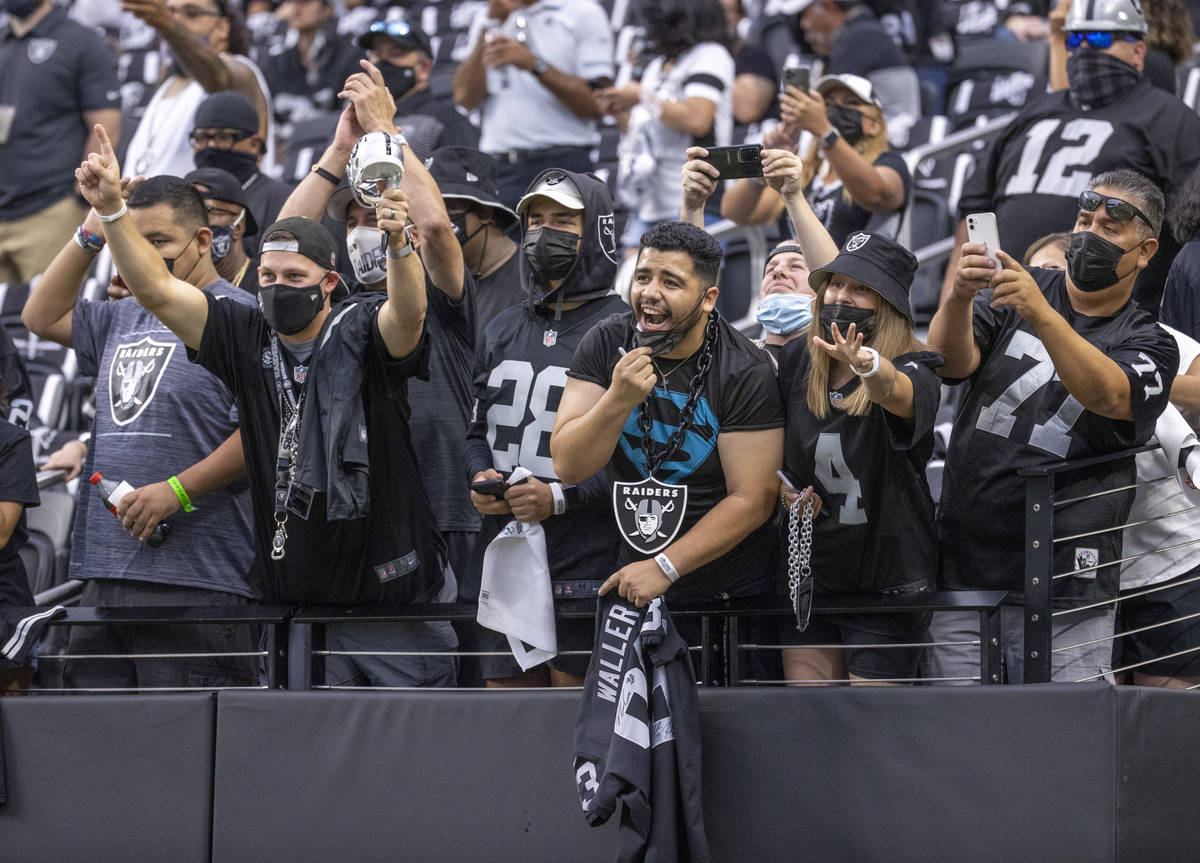 Fans yell for players before the Raiders home opening pre-season NFL football game versus the S ...