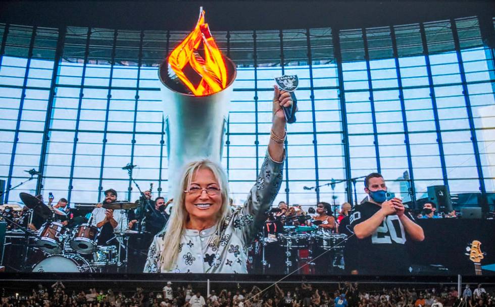 Dr. Miriam Adelson lights the Al Davis Memorial Torch Flame before the Raiders home opening pre ...