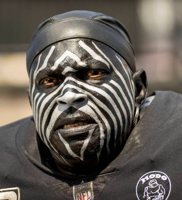 Raider's super fan Violator enters the stadium with others before the Raiders home opening pre- ...