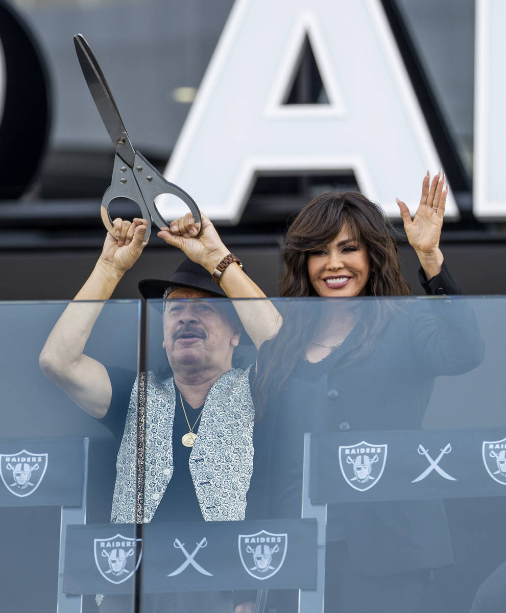 Carlos Santana and Marie Osmond are introduced during the official ribbon cutting ceremony befo ...