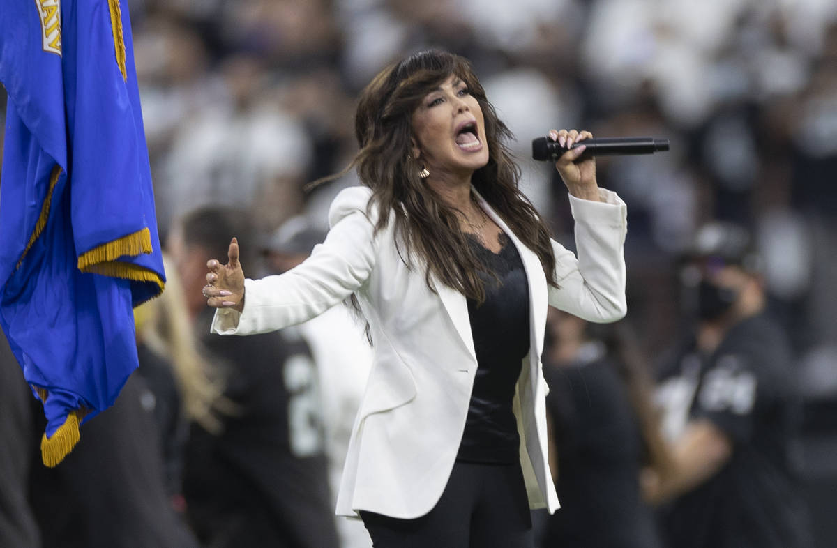 Marie Osmond performs the national anthem before the start of an NFL preseason football game be ...