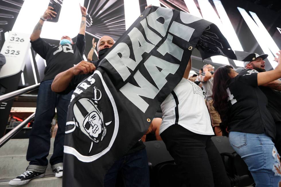 Rafael Villagrana celebrates a Las Vegas Raiders touchdown against the Seattle Seahawks in the ...