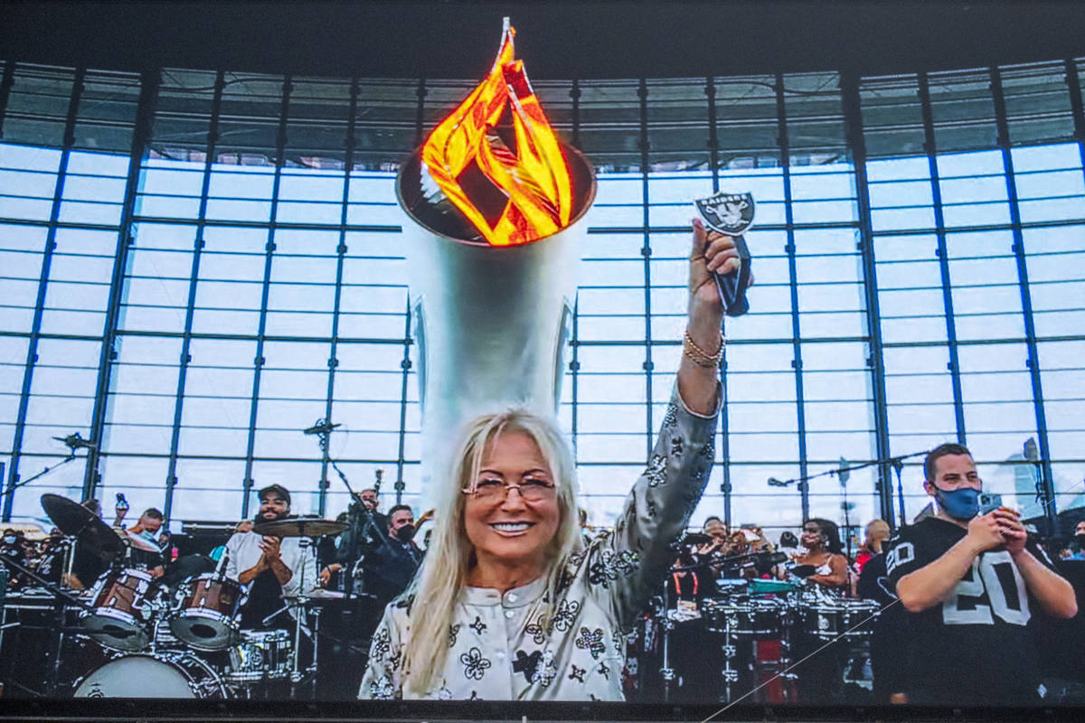 Dr. Miriam Adelson lights the Al Davis Memorial Torch Flame before the Raiders home opening pre ...