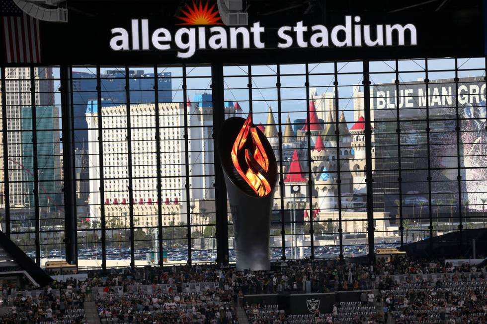 Dr. Miriam Adelson lights the Al Davis Memorial Torch Flame before the starts of a NFL preseaso ...