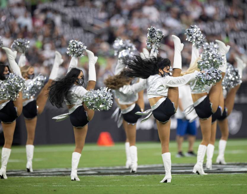 The Las Vegas Raiderettes perform during an NFL preseason football game against the Seattle Sea ...