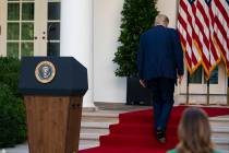 Donald Trump walks off after speaking during a news conference. (AP Photo/Evan Vucci)