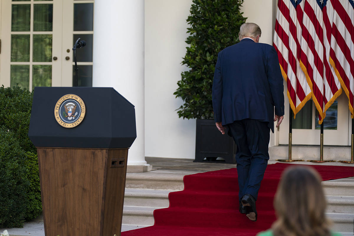 Donald Trump walks off after speaking during a news conference. (AP Photo/Evan Vucci)