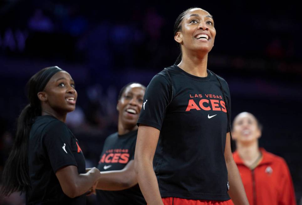 Las Vegas Aces forward A'ja Wilson (22) jokes around with teammates before the start of a WNBA ...