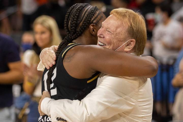 Las Vegas Aces guard Chelsea Gray (12) hugs Raiders owner Mark Davis after Gray hit the winning ...