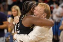 Las Vegas Aces guard Chelsea Gray (12) hugs Raiders owner Mark Davis after Gray hit the winning ...