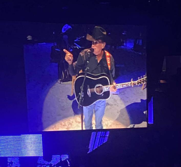 George Strait is shown on the big screen in his return to T-Mobile Arena on Friday, Aug. 13, 20 ...