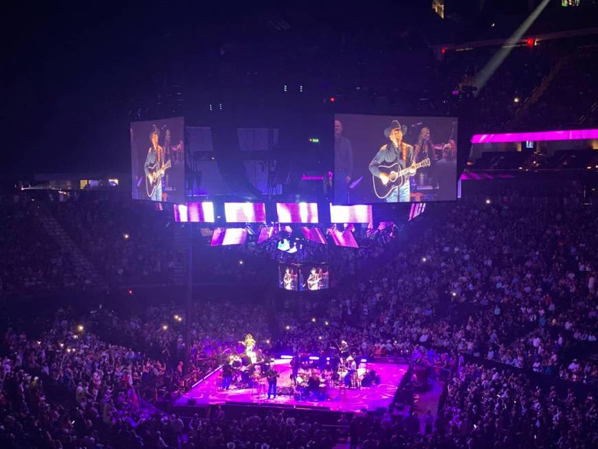 George Strait is shown on the big screen in his return to T-Mobile Arena on Friday, Aug. 13, 20 ...