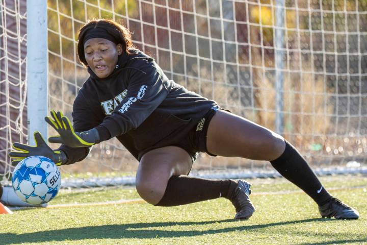 Goalkeeper Jordan Brown defends the net during a girlÕs soccer team practice at Faith Luth ...