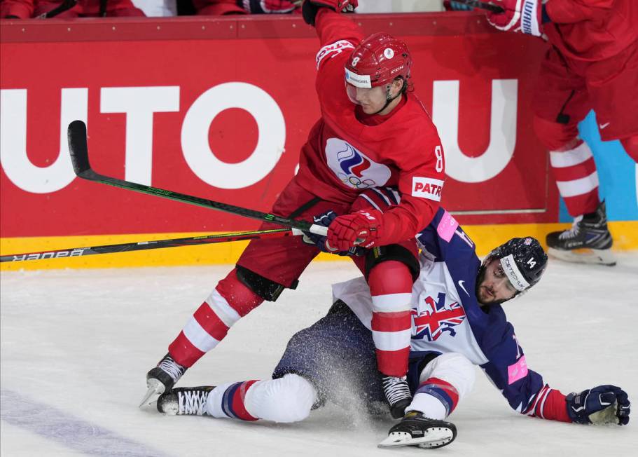 Liam Kirk of Great Britain, right, and Ivan Morozov of Russia fight for the puck during the Ice ...