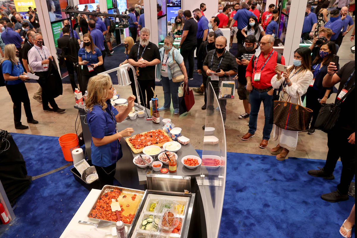 Donatella Arpaia puts on a pizza demonstration in the Galbani Professionale booth during the In ...