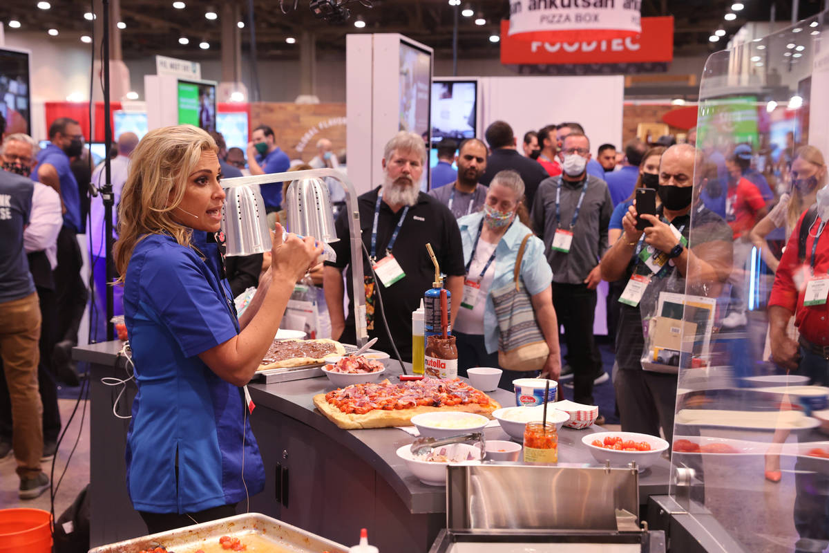 Donatella Arpaia puts on a pizza demonstration in the Galbani Professionale booth during the In ...