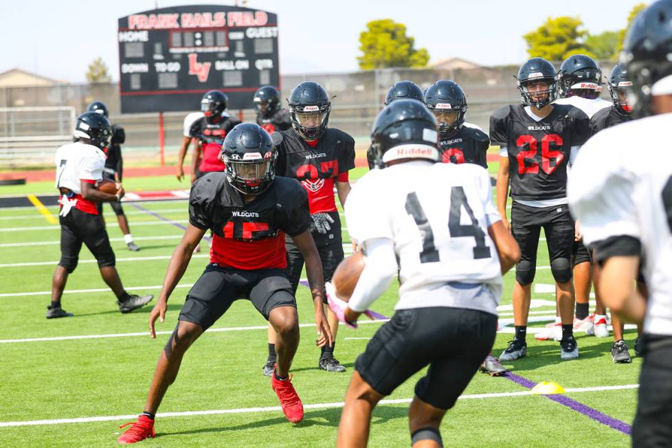 Players practice drills during football practice at Las Vegas High School in Las Vegas, Tuesday ...