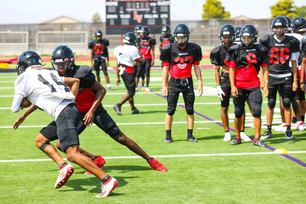 Players practice drills during football practice at Las Vegas High School in Las Vegas, Tuesday ...