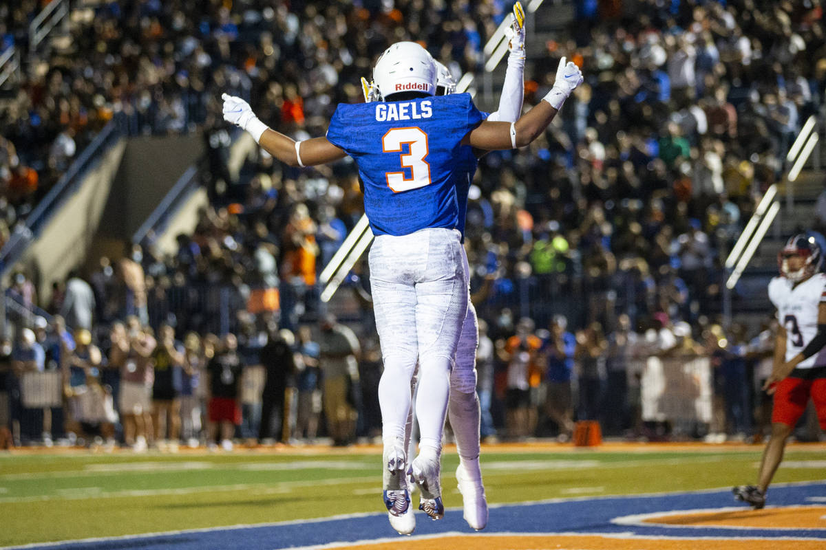 Bishop Gorman's Cam'ron Barfield (3) celebrates a rushing touchdown with teammate Zachariah Bra ...