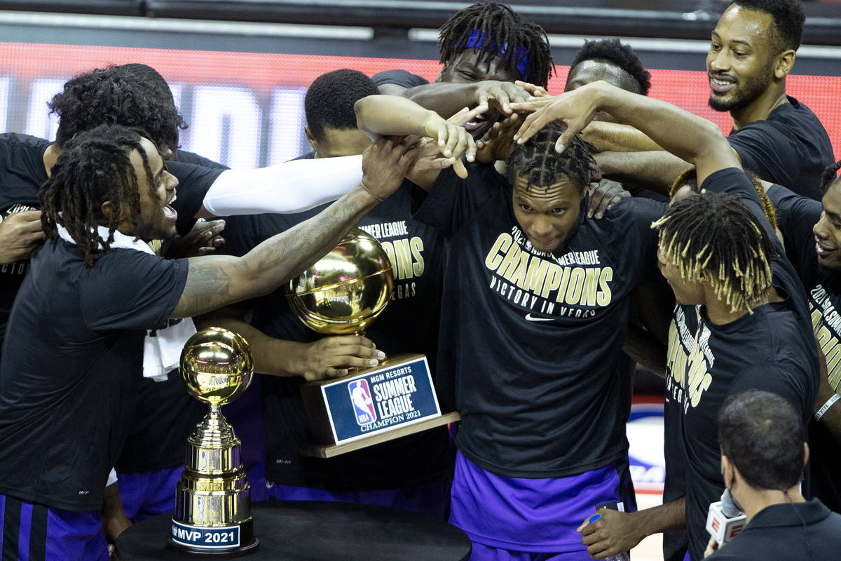 Sacramento Kings forward Louis King, center, is congratulated by his teammates after it is anno ...