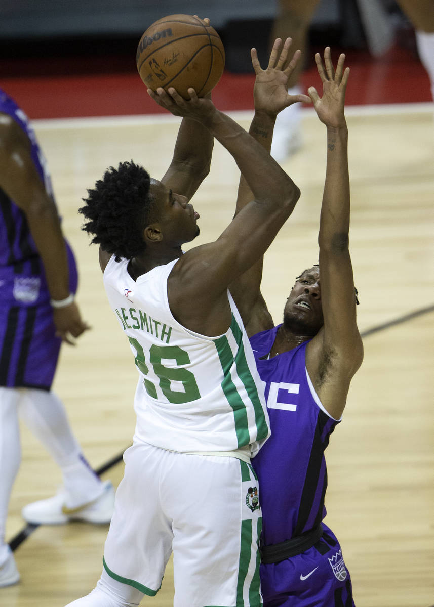 Boston Celtics forward Aaron Nesmith (26) attempts a three-point shot while Sacramento Kings fo ...