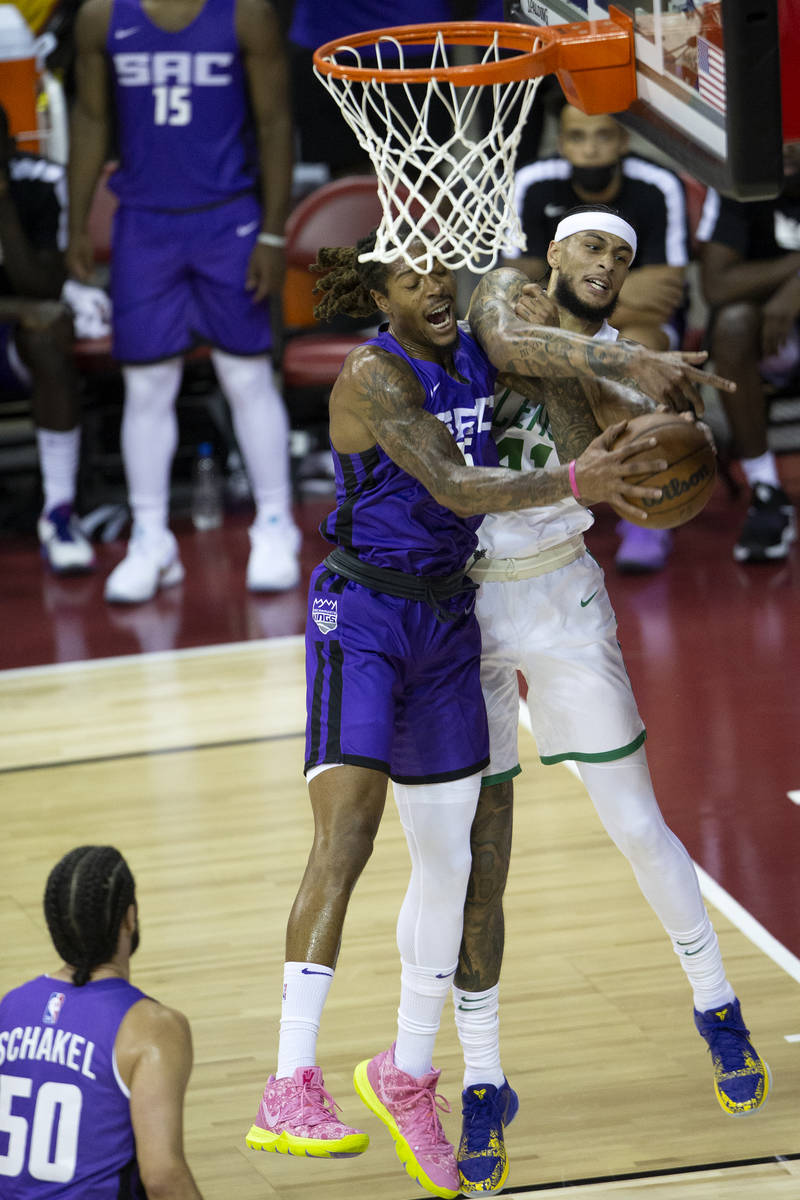 Sacramento Kings forward Emanuel Terry (26) knocks down a shot by Boston Celtics center Zach Au ...