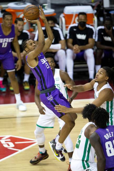 Sacramento Kings forward Louis King (23) shoots a three pointer guarded by Boston Celtics guard ...