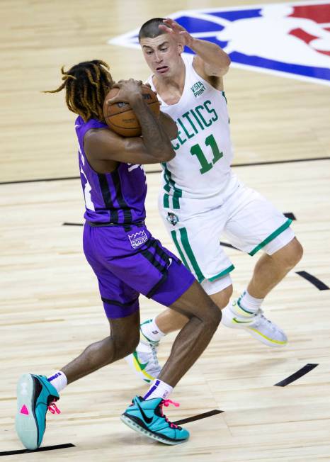 Boston Celtics guard Payton Pritchard (11) guards Sacramento Kings guard DJ Steward (32) during ...
