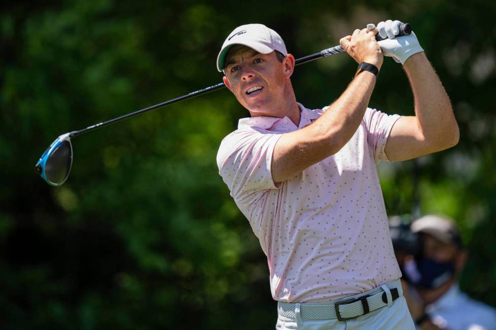Rory McIlroy tees off on the seventh hole during the fourth round of the Wells Fargo Championsh ...