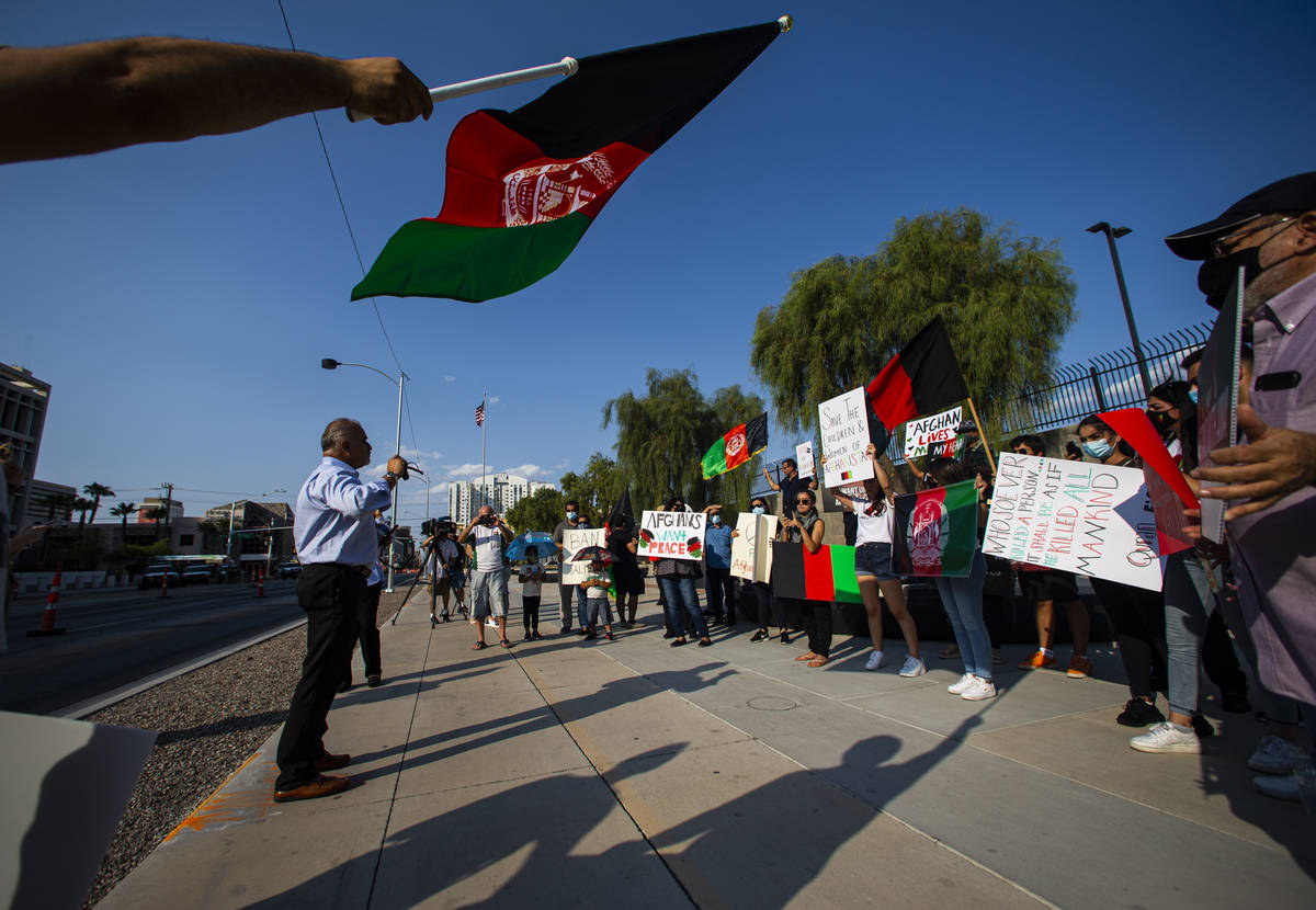 Rokai Yusufzai, left, speaks during a protest against the Taliban and in support of Afghanistan ...