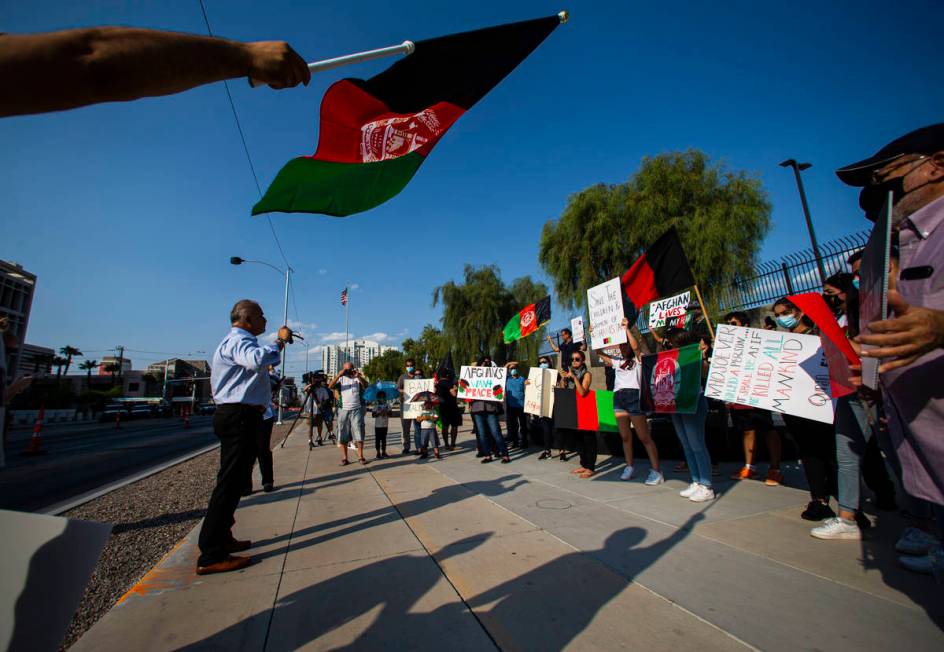 Rokai Yusufzai, left, speaks during a protest against the Taliban and in support of Afghanistan ...