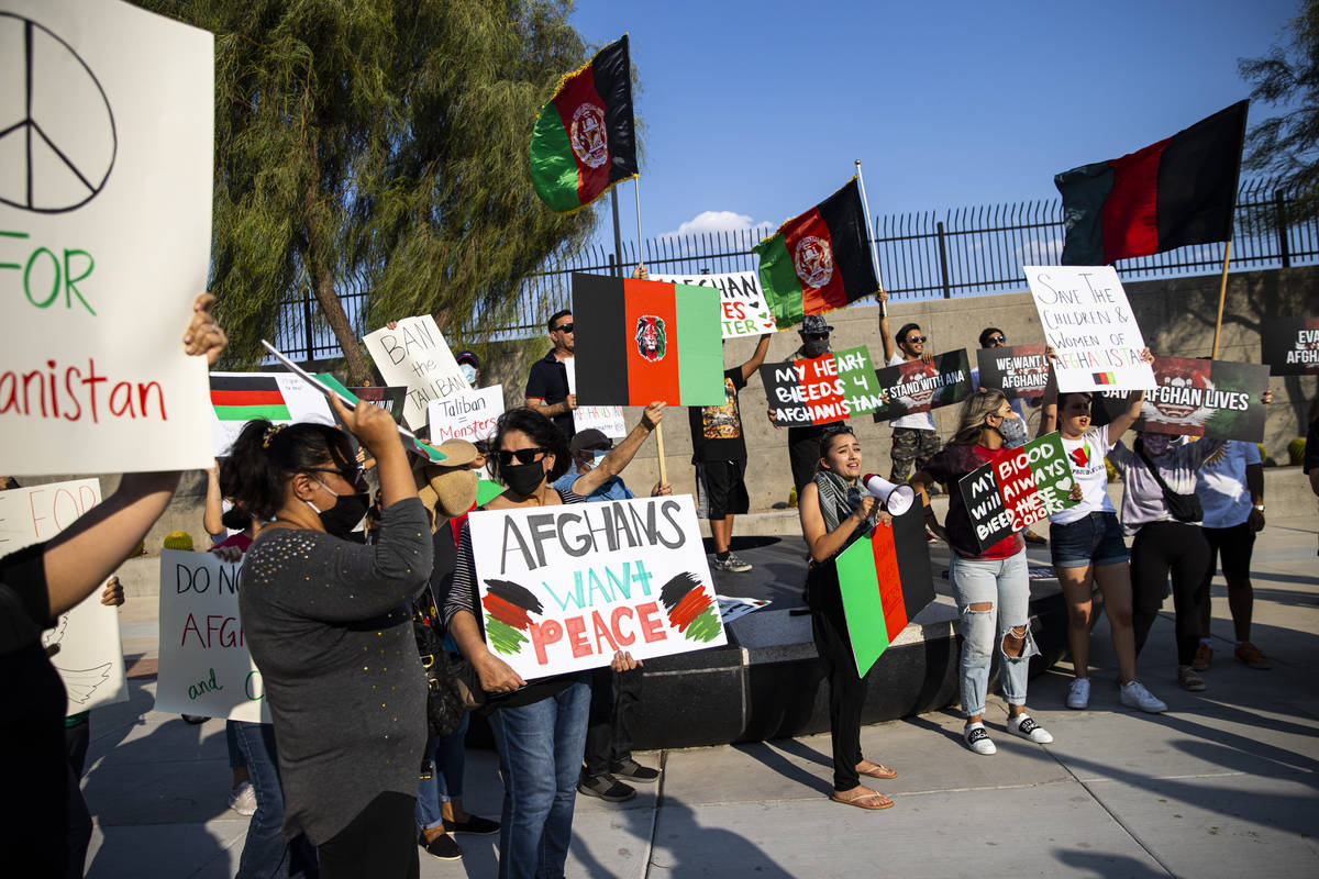 Medinah Yusufzai, center right, speaks during a protest against the Taliban and in support of A ...