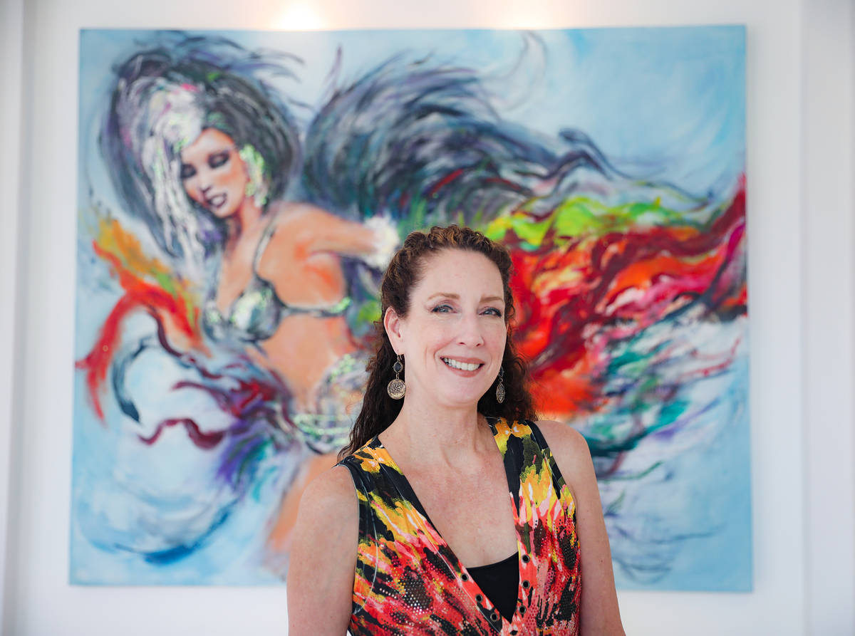 Jacqueline Koenig, a former dancer and showgirl, in front of a painting of her by artist Terry ...