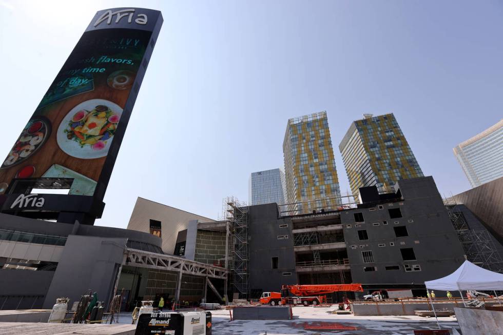 Workers dismantle the south core of the former Harmon hotel to make room for a four-story retai ...