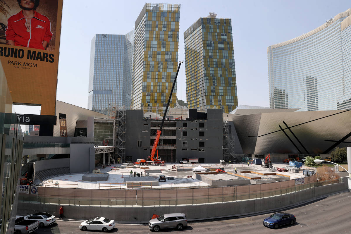 Workers dismantle the south core of the former Harmon hotel to make room for a four-story retai ...