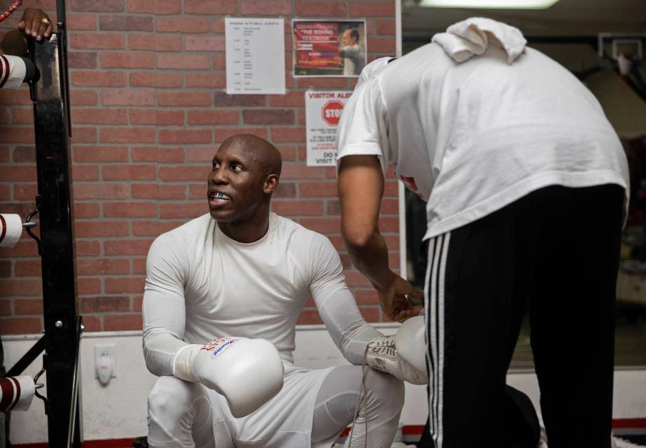 Welterweight Yordenis Ugas, left, has his gloves removed during a training session for his upco ...