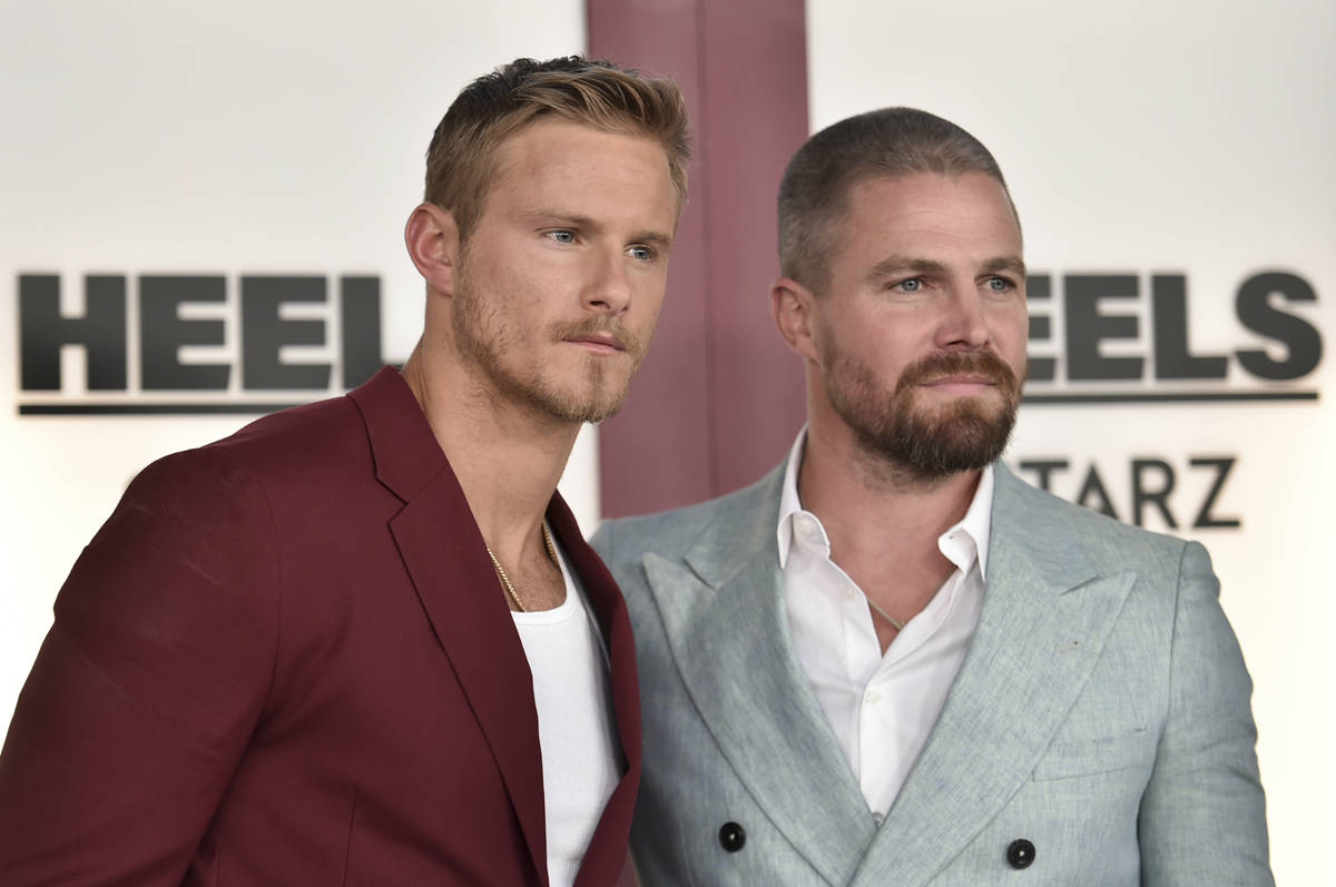 Alexander Ludwig, left, and Stephen Amell arrive at the premiere of "Heels" on Tuesda ...