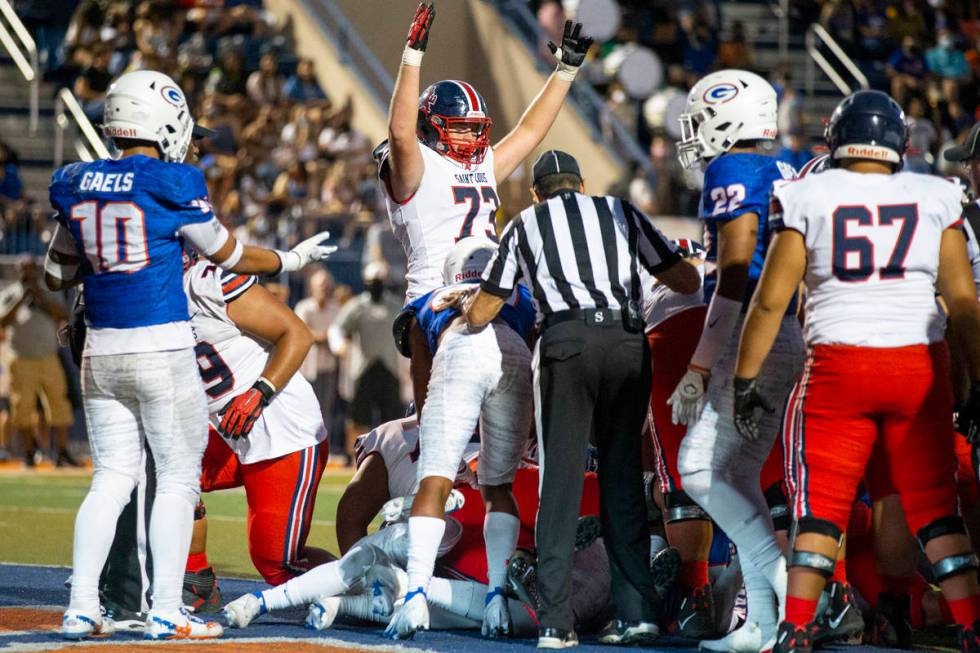 St. Louis score a touchdown against Bishop Gorman during the second quarter of a football game ...