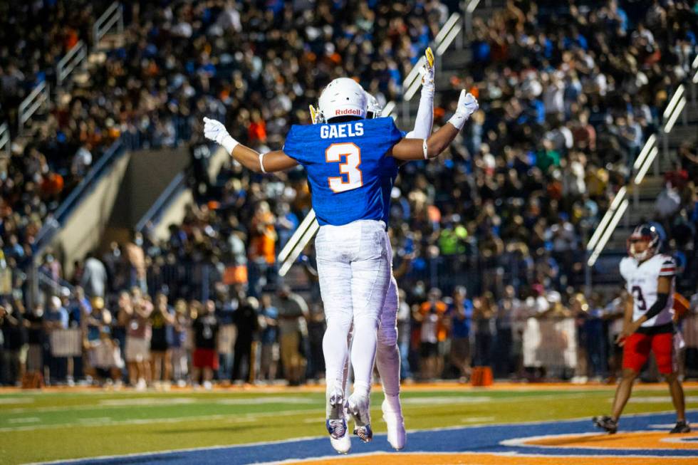 Bishop Gorman's Cam'ron Barfield (3) celebrates a rushing touchdown with teammate Zachariah Bra ...