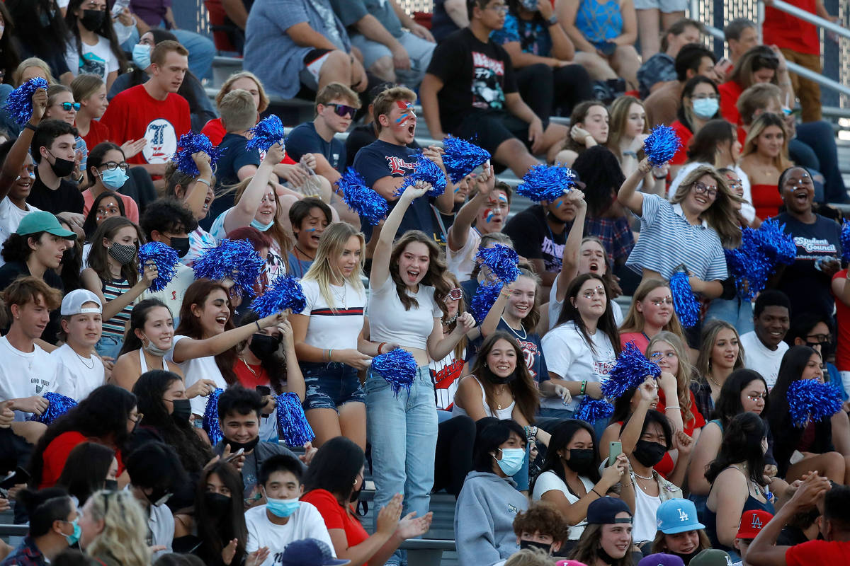 Liberty High School fans cheer during the first half of a football game against Arbor View High ...