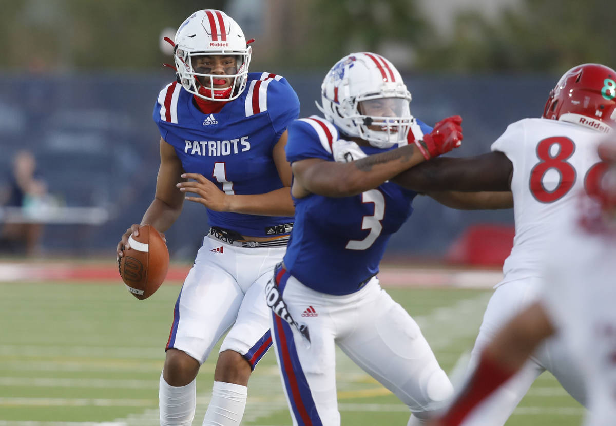 Liberty High School quarterback Jayden Maiava (1) looks to throw the ball as Liberty High Schoo ...