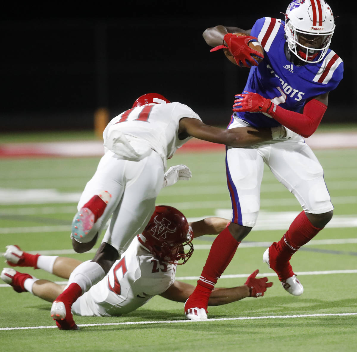 Liberty High School's Germie Bernard (2), left, keeps a ball away from Arbor View High School's ...