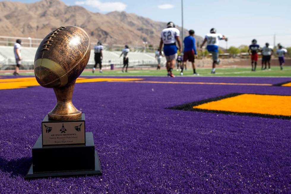 The "Air Space Showdown" trophy is posed as the Sunrise Mountain High School varsity ...
