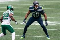 In this Sunday, Dec. 13, 2020, file photo, Seattle Seahawks linebacker K.J. Wright plays a snap ...