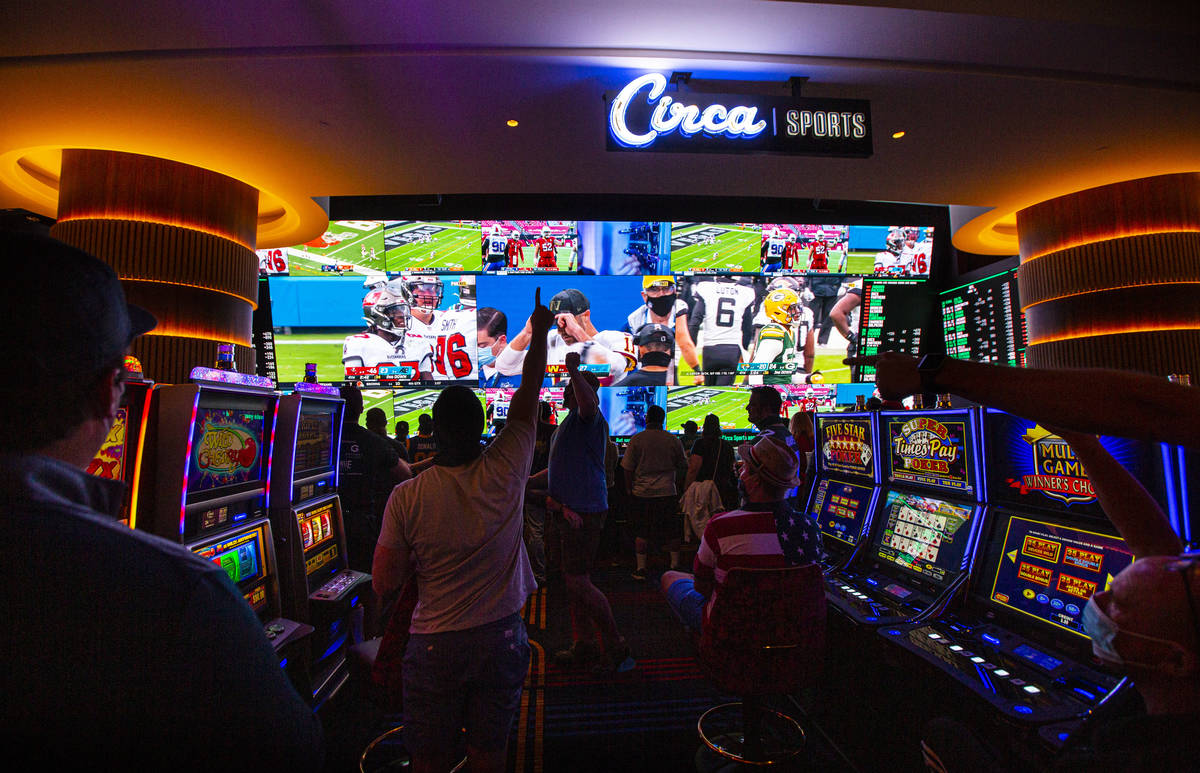 Football fans take in the action at the Circa Sportsbook as NFL games play across the 78-millio ...