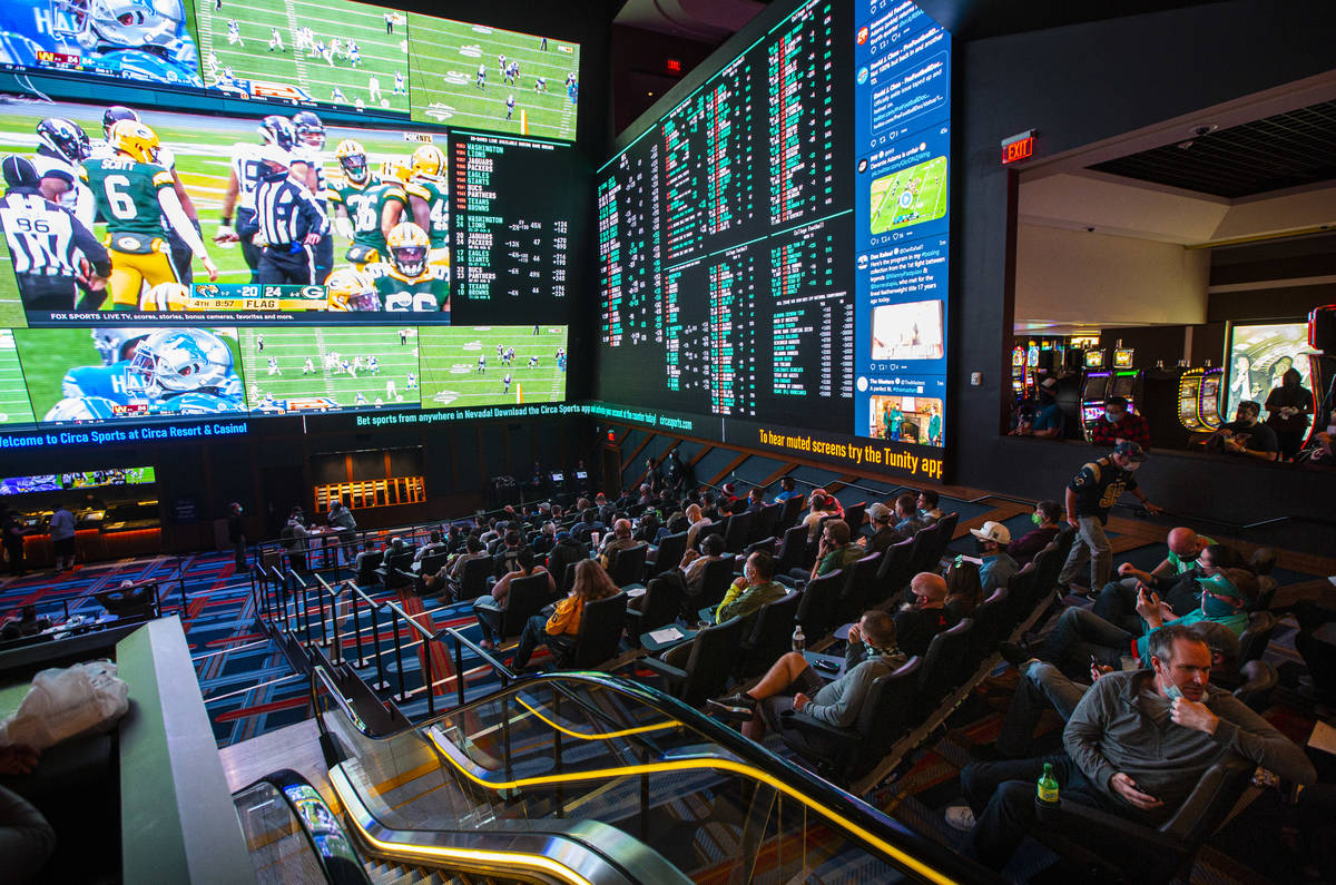 Football fans take in the action at the Circa Sportsbook as NFL games play across the 78-millio ...