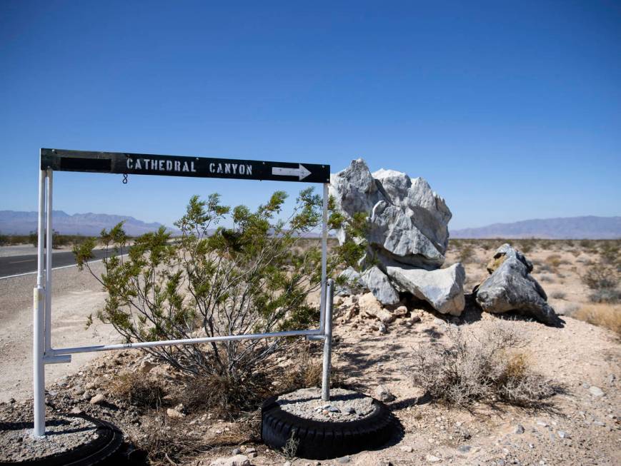 The sign pointing to Cathedral Canyon is shown near a cliff, on Wednesday, Aug. 18, 2021 where ...