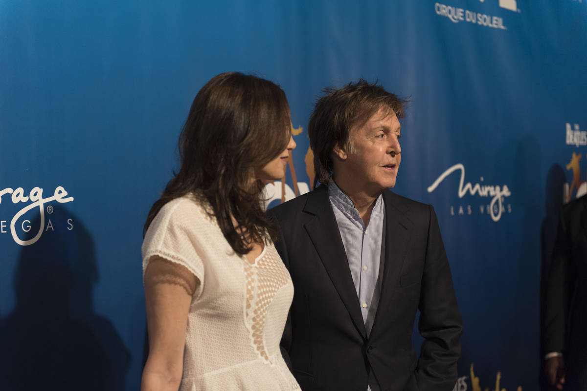 Paul McCartney, right, and his wife Nancy Shevell pose during a red carpet event to celebrate t ...