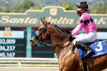 Abel Cedillo, top, leads Fighting Mad to the Winner's Circle after their victory in the Grade I ...